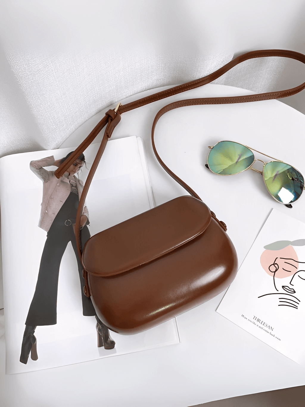Bolsa Feminina em Couro PU com Design Arredondado e Alça Regulável – Odete